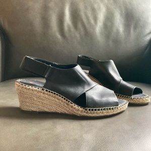 Black Clarks wedge sandals with woven jute heel
